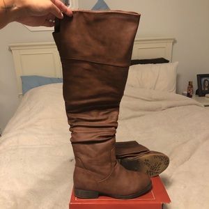 Above the knee tan boots